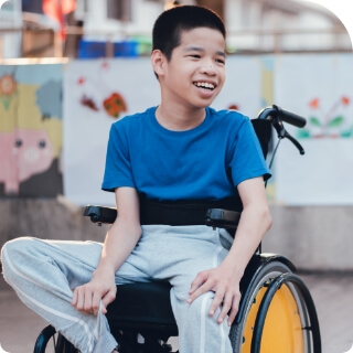 Happy boy in wheelchair